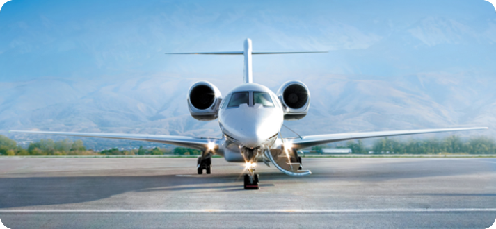 A white jet airplane on the runway with its wheels down.